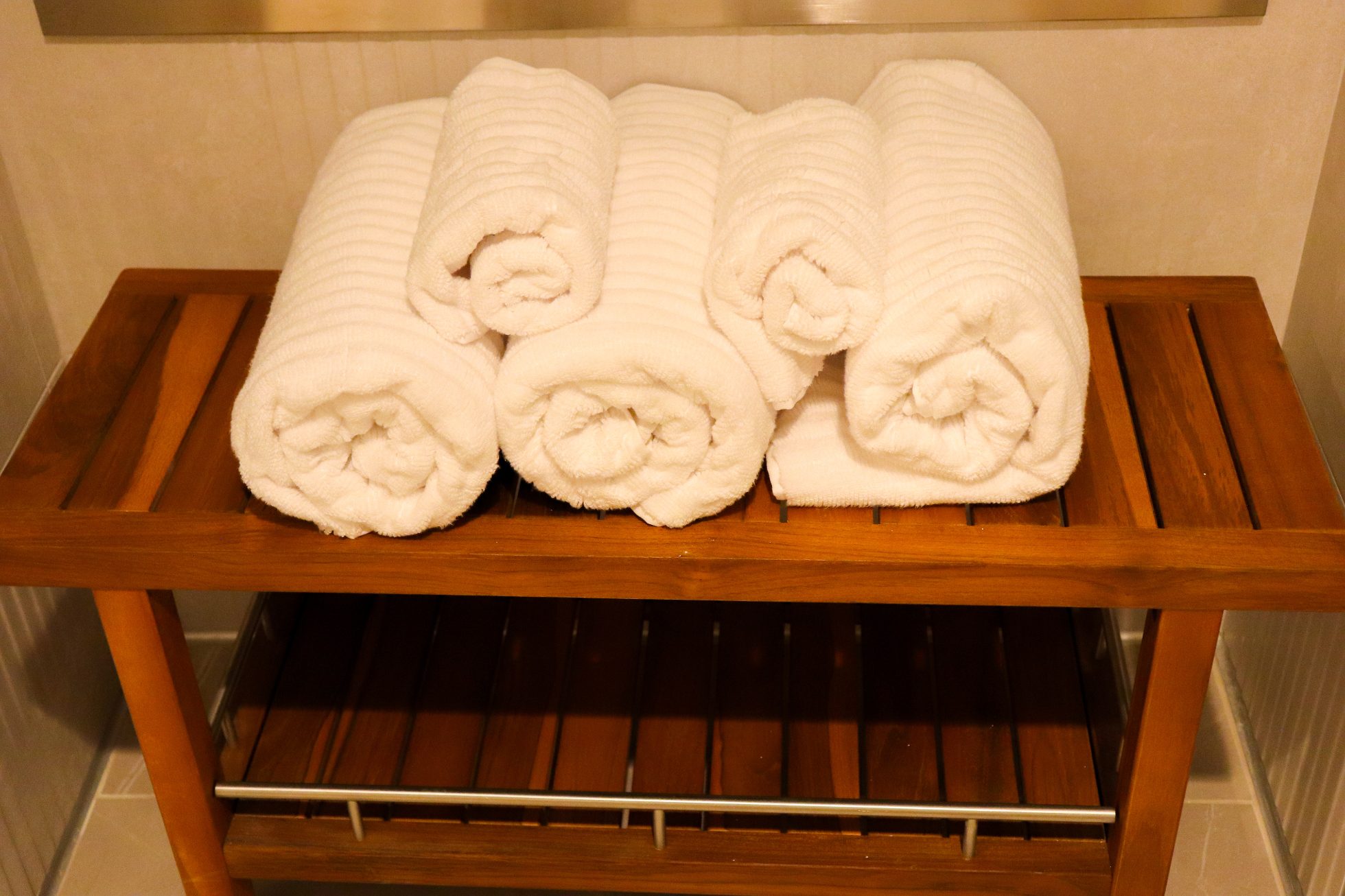Shelf with clean white towels for Business Lounge guests in Chicago