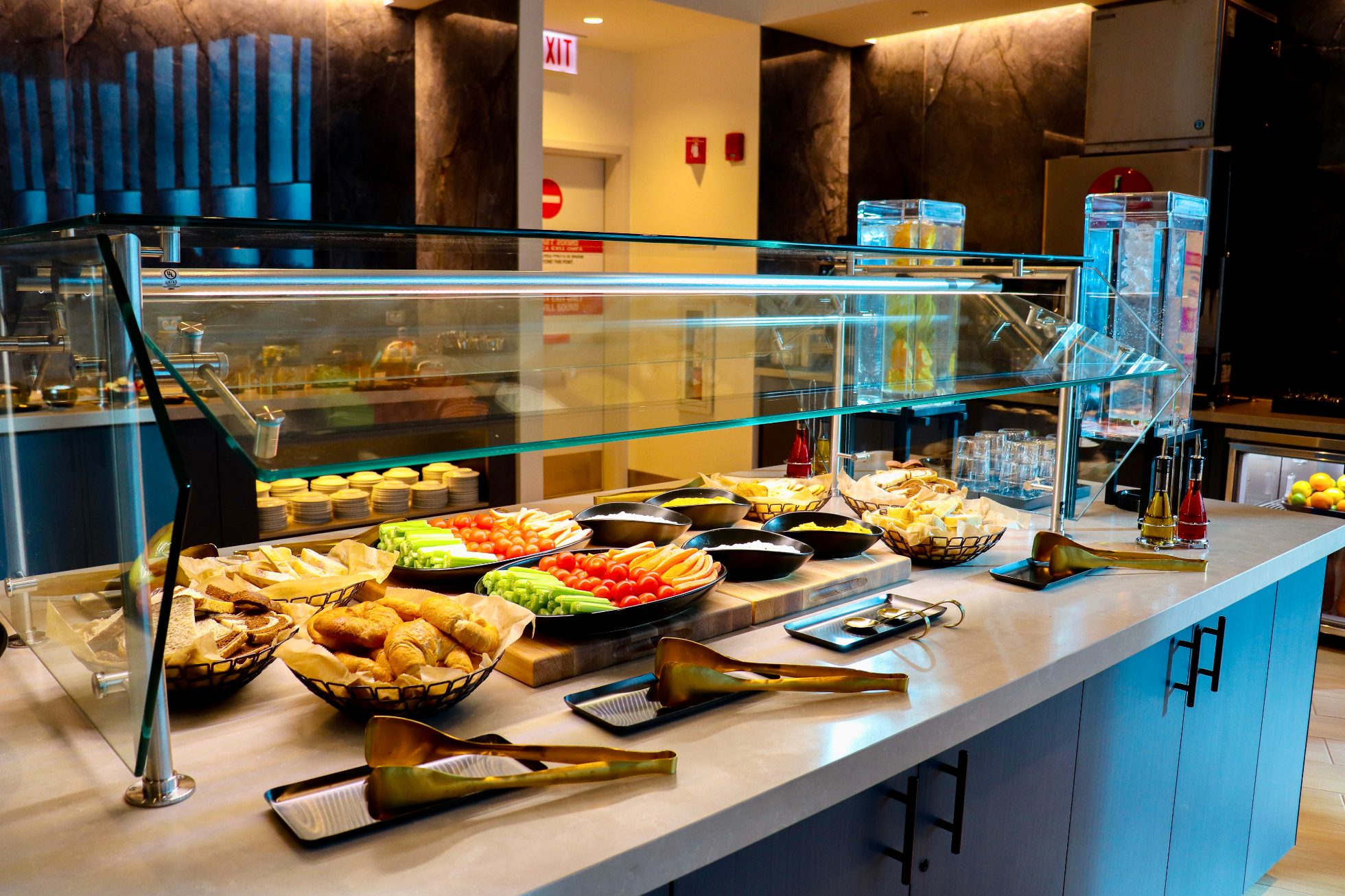 Snack bar in Chicago airport Business Lounge - rolls, vegetables, fruits, cheeses