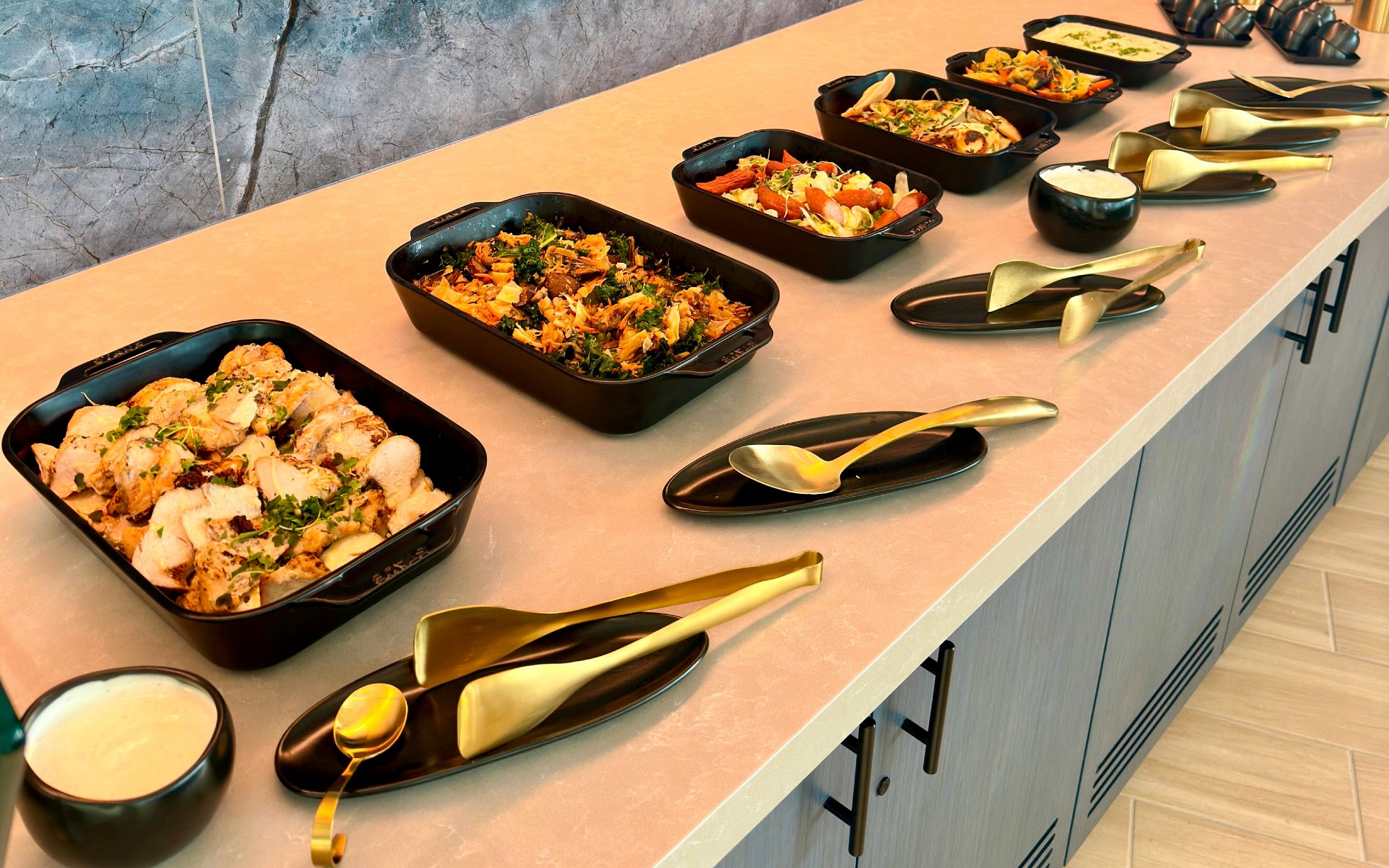 Swedish buffet with a selection of elegant dishes arranged on a long table in the Business Lounge in Chicago