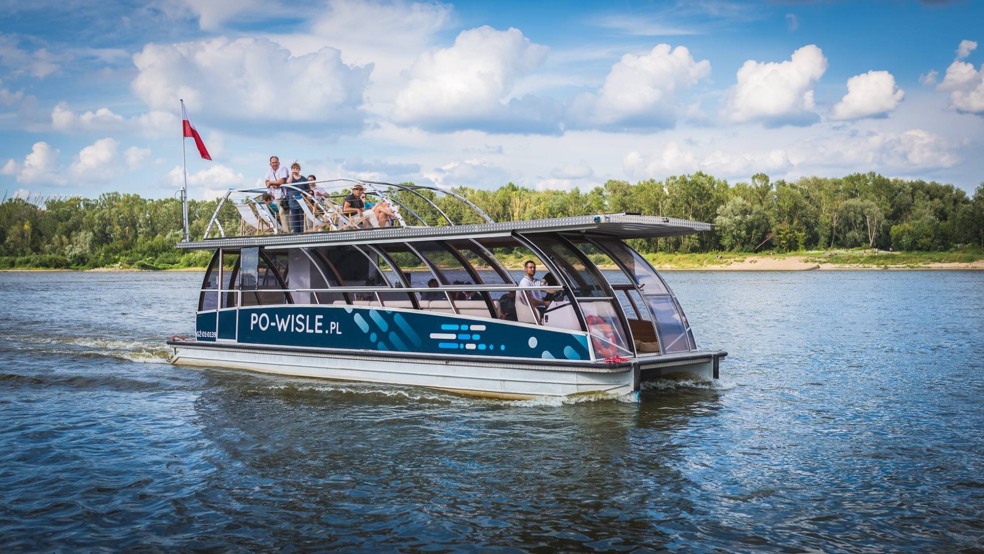 The "Po Wiśle" boat during a cruise with passengers onboard.