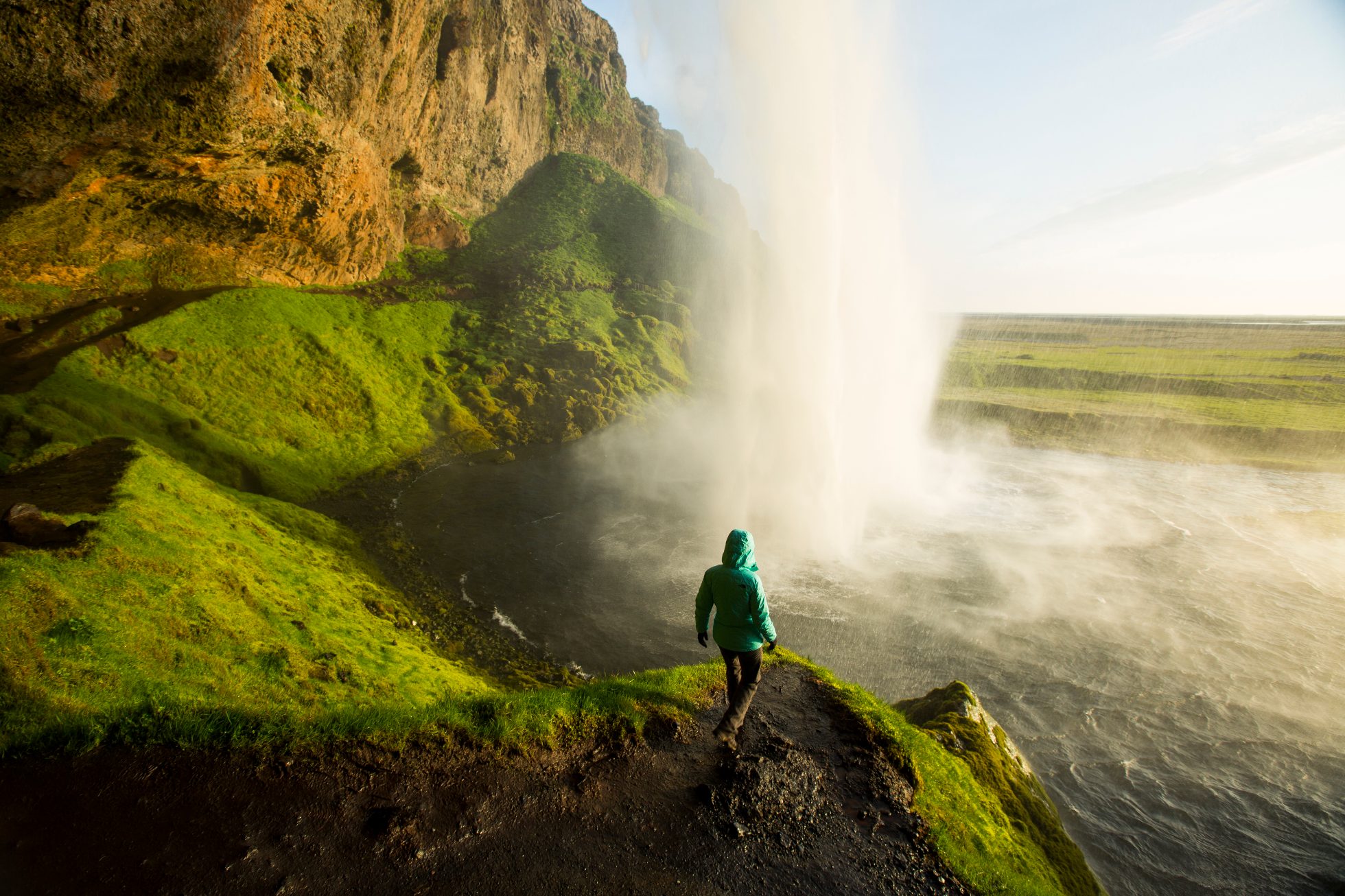 Woman watching a waterfall in Iceland