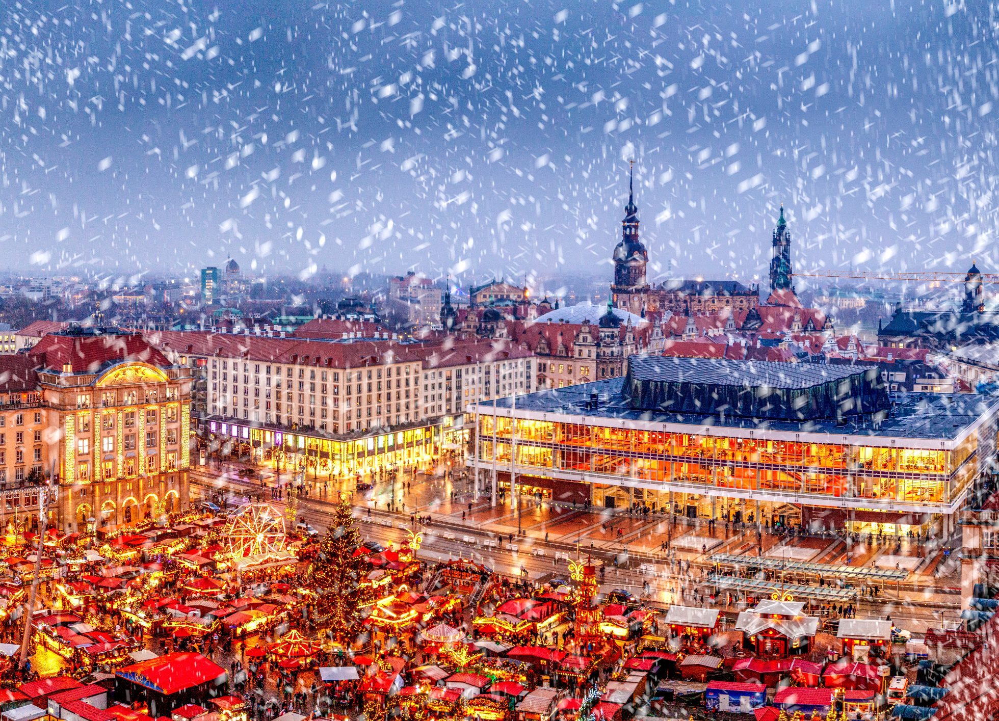 The Striezelmarkt in Dresden is one of the oldest and largest Christmas markets in the World. It is visited by almost half million visitors annually. Photographed here on a December evening from an elevation point.