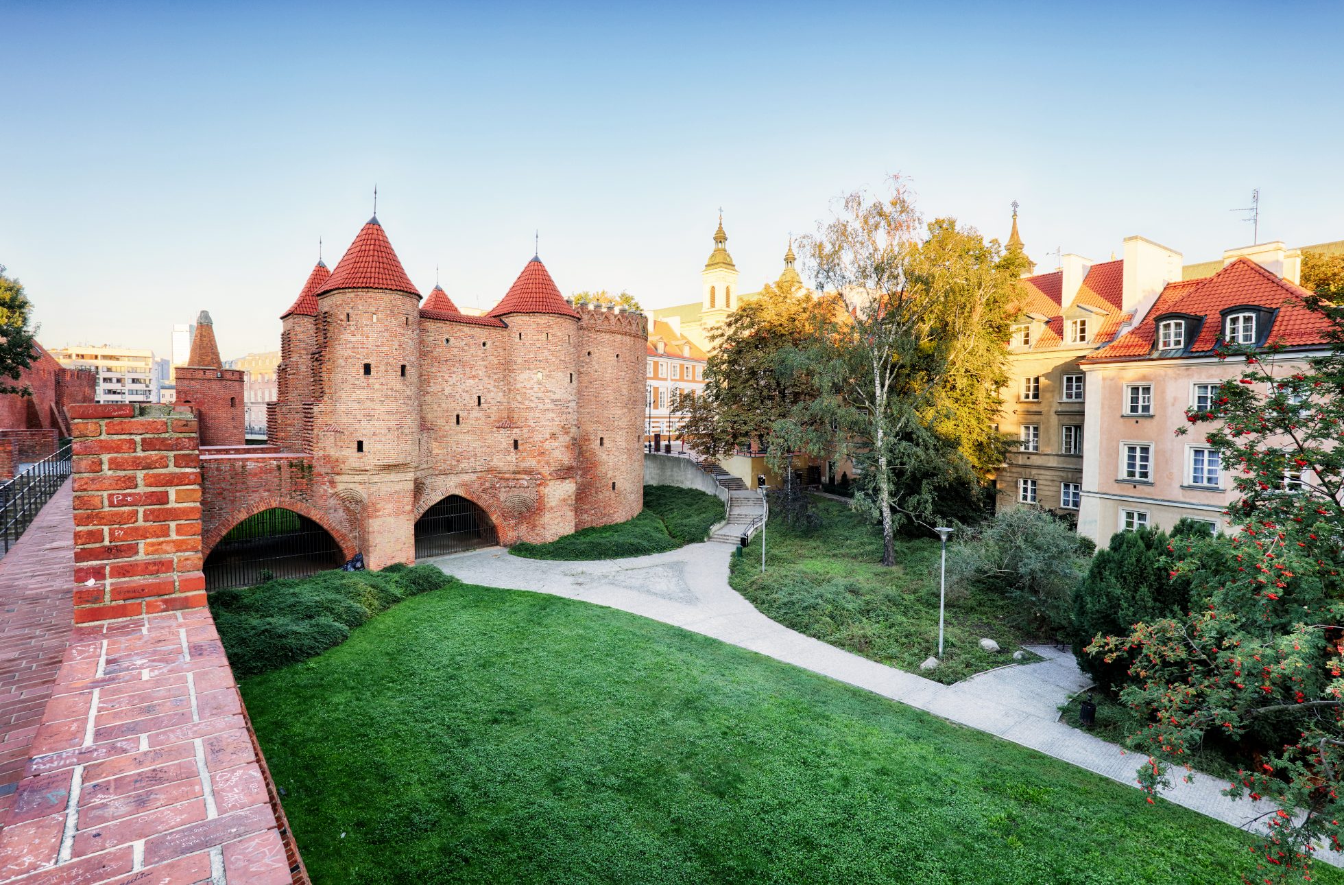 A photo of the brick defensive wall of the Barbican in Warsaw.