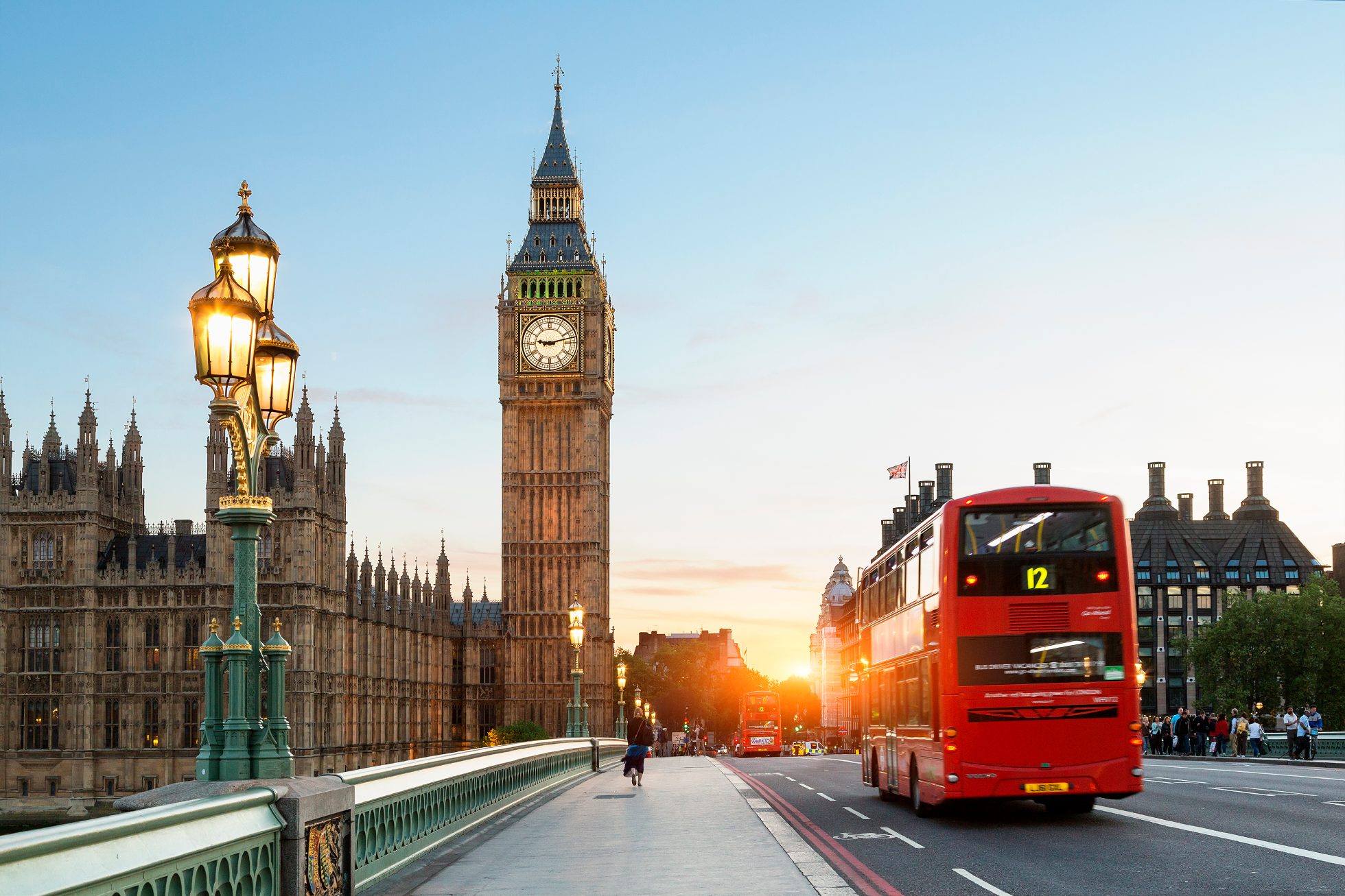 Big Ben and a red bunk bus at sunrise