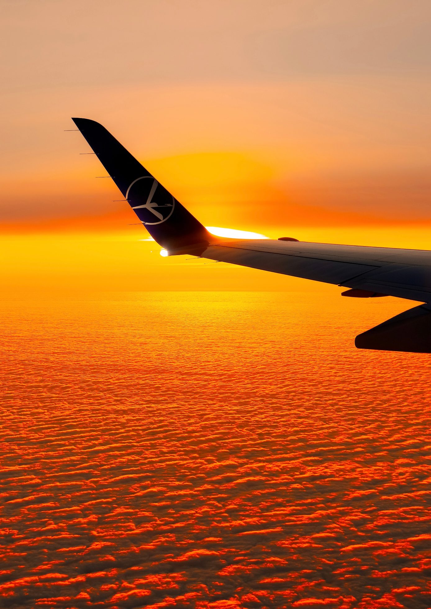 Embraer 175 wing at sunset