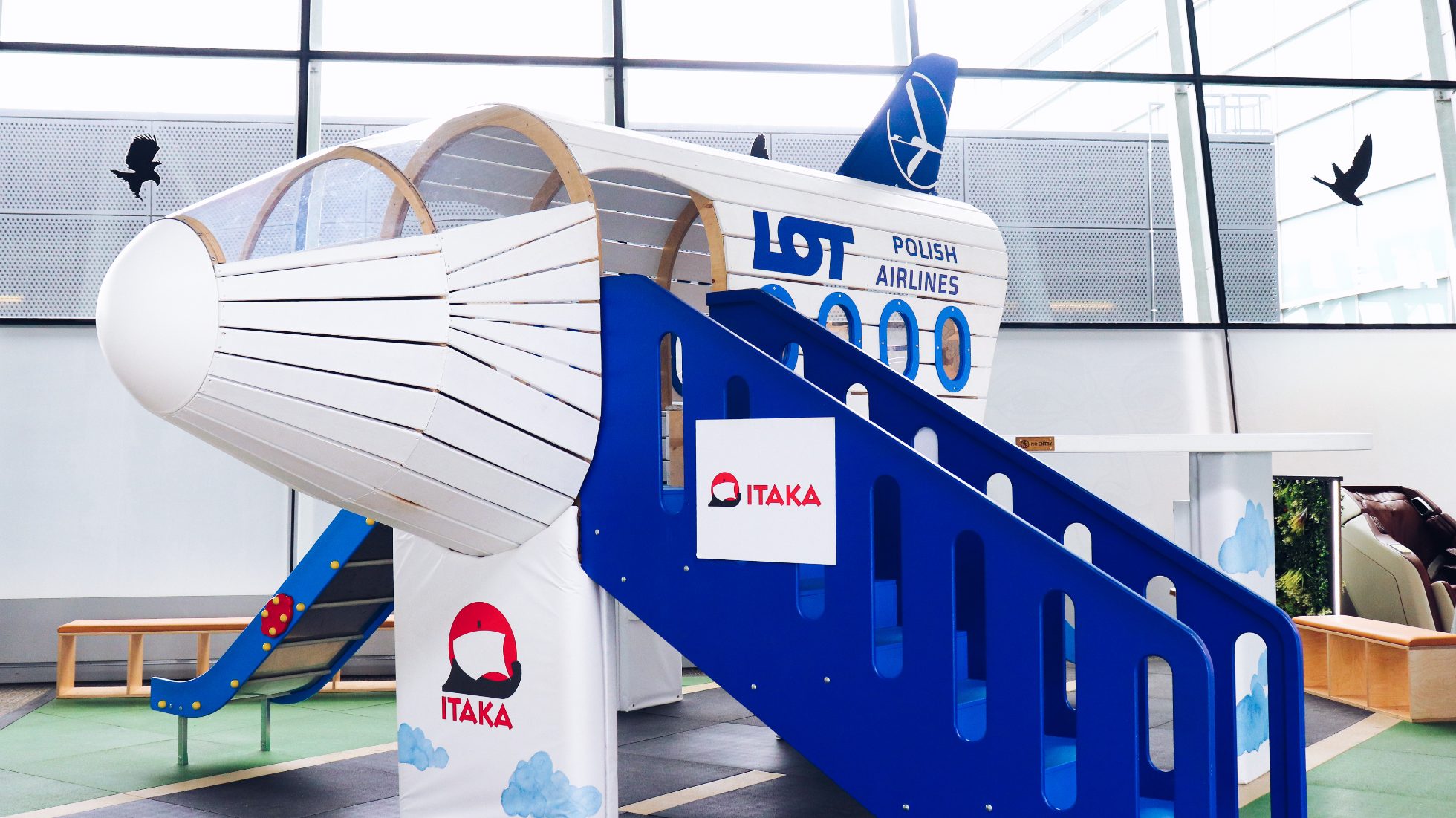 playground for children - plane of LOT Polish Airlines with slide at Warsaw Chopin Airport