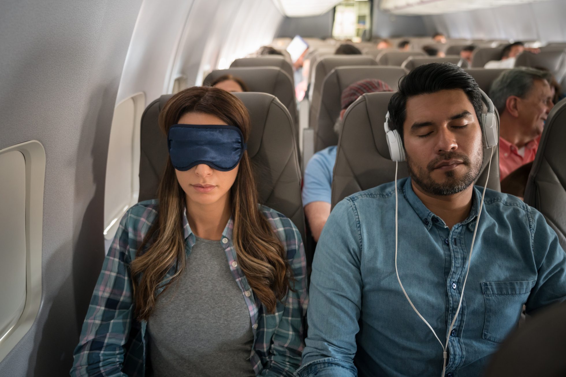 What is jet lag? Passengers try to sleep on the plane to alleviate jet lag.