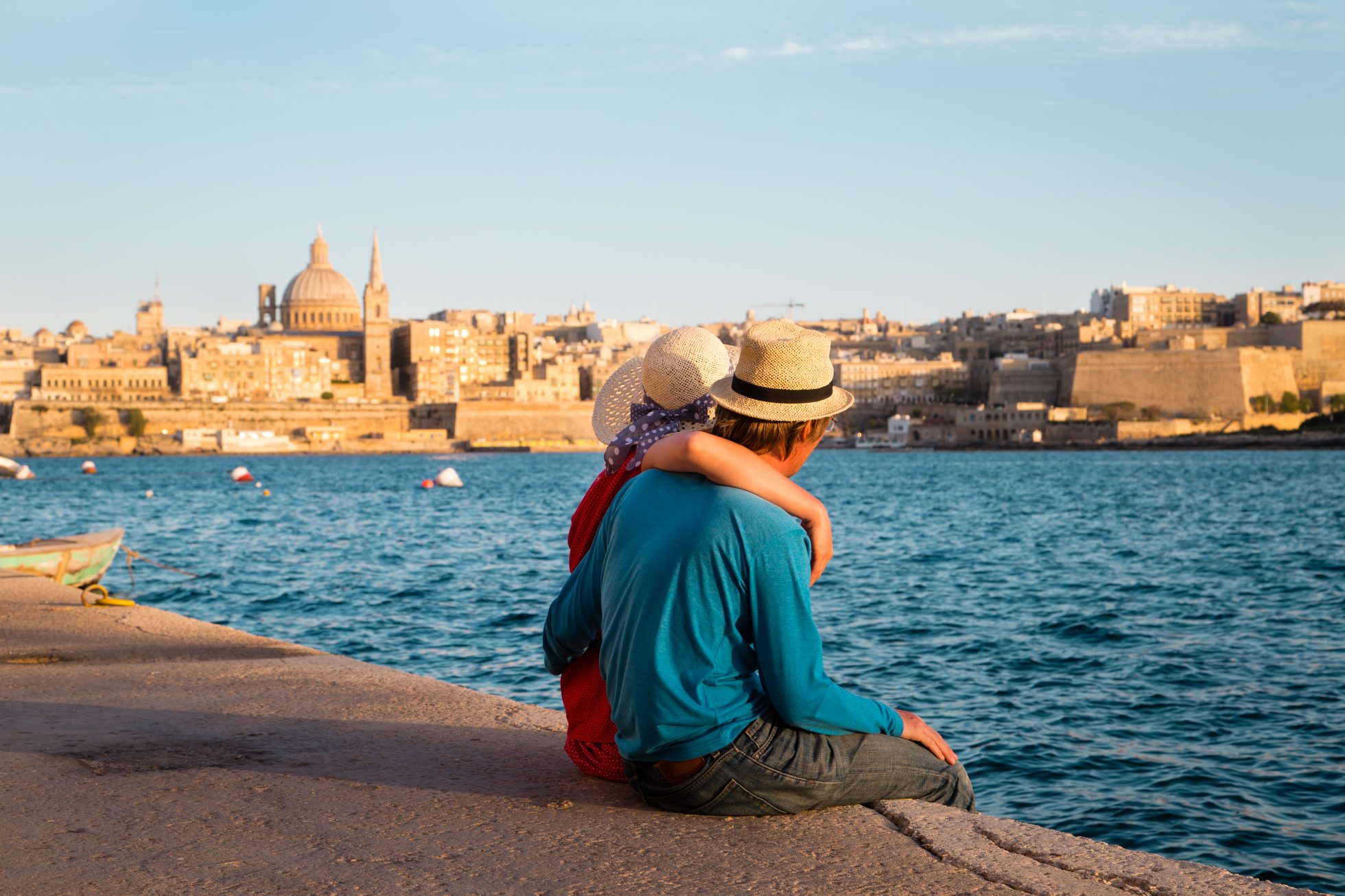 Couple relaxing on the seashore in Valletta