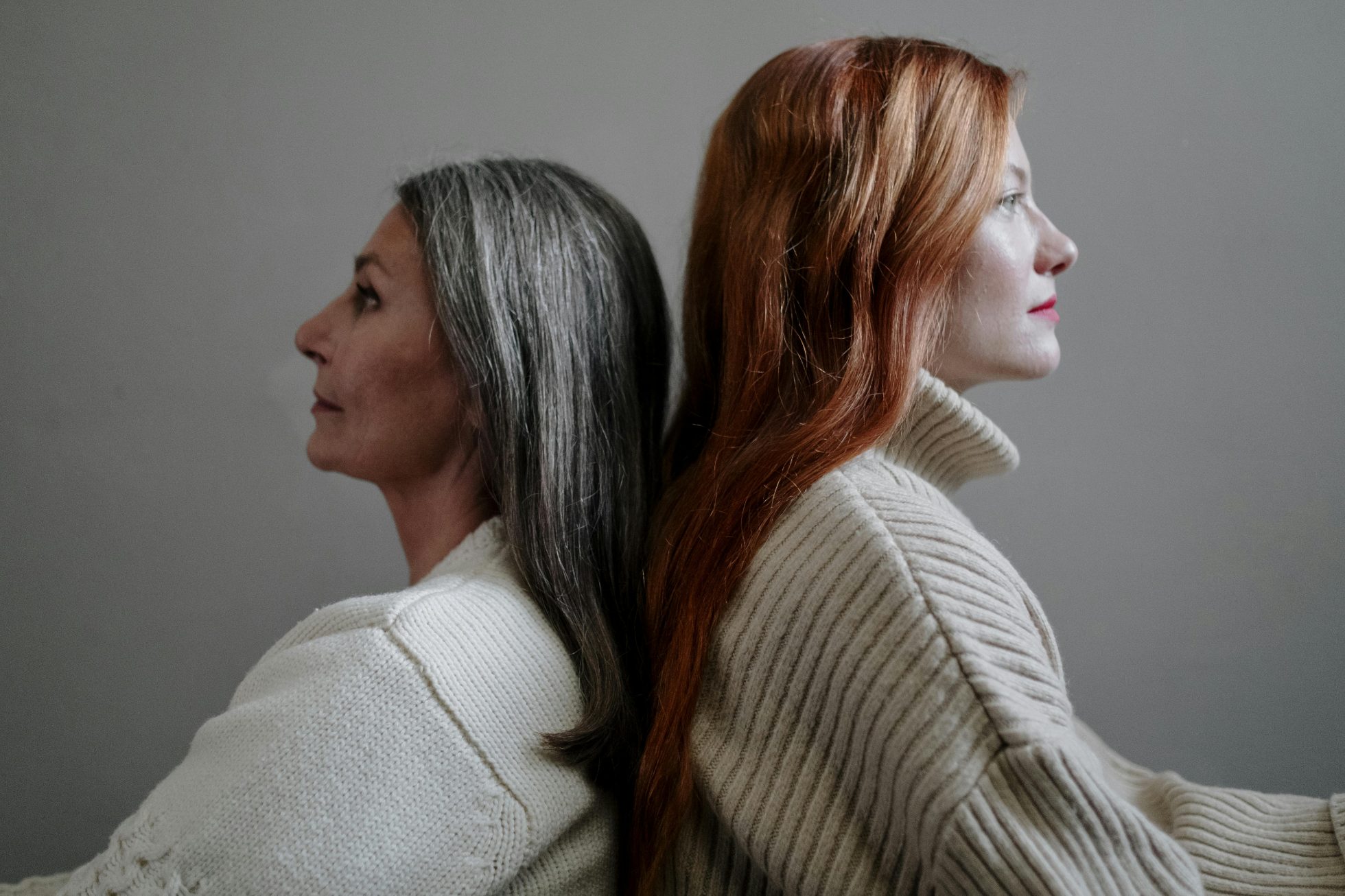 Older and younger woman posing in profile