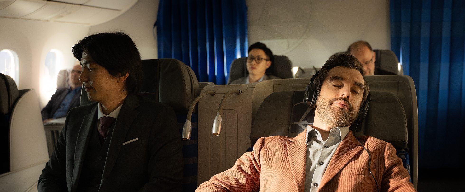 LOT Business Class passenger sleeping during the flight