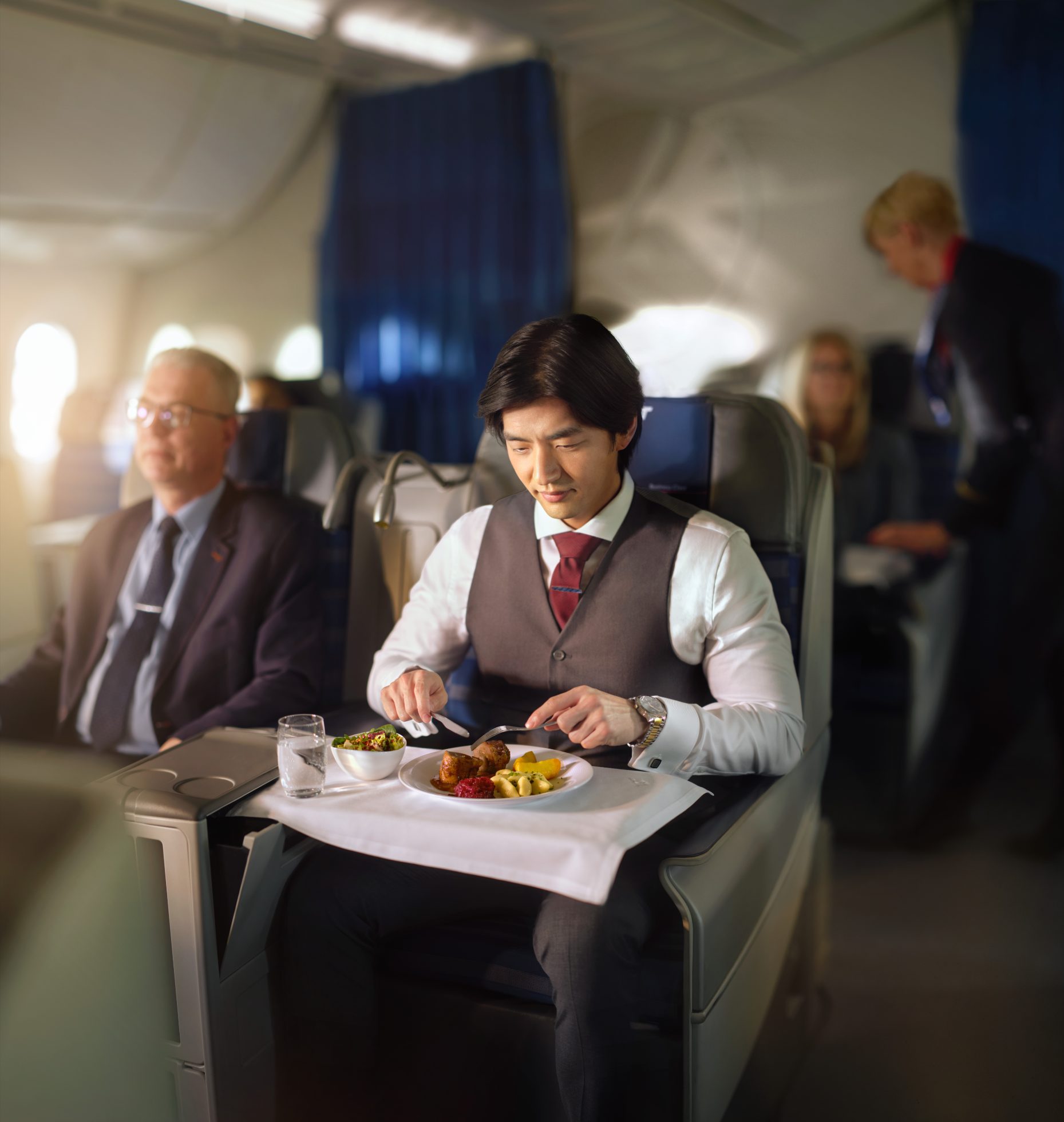 Passenger enjoys LOT Business Class benefits on board Dreamliner