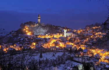 Illuminated town of Štramberk in the Czech Republic on a winter evening.