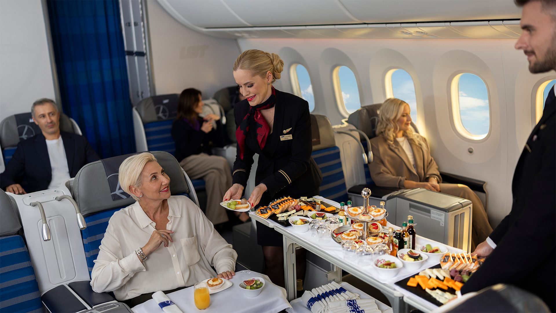 Cabin crew serving LOT Business Class passengers on board Boeing 787 Dreamliner