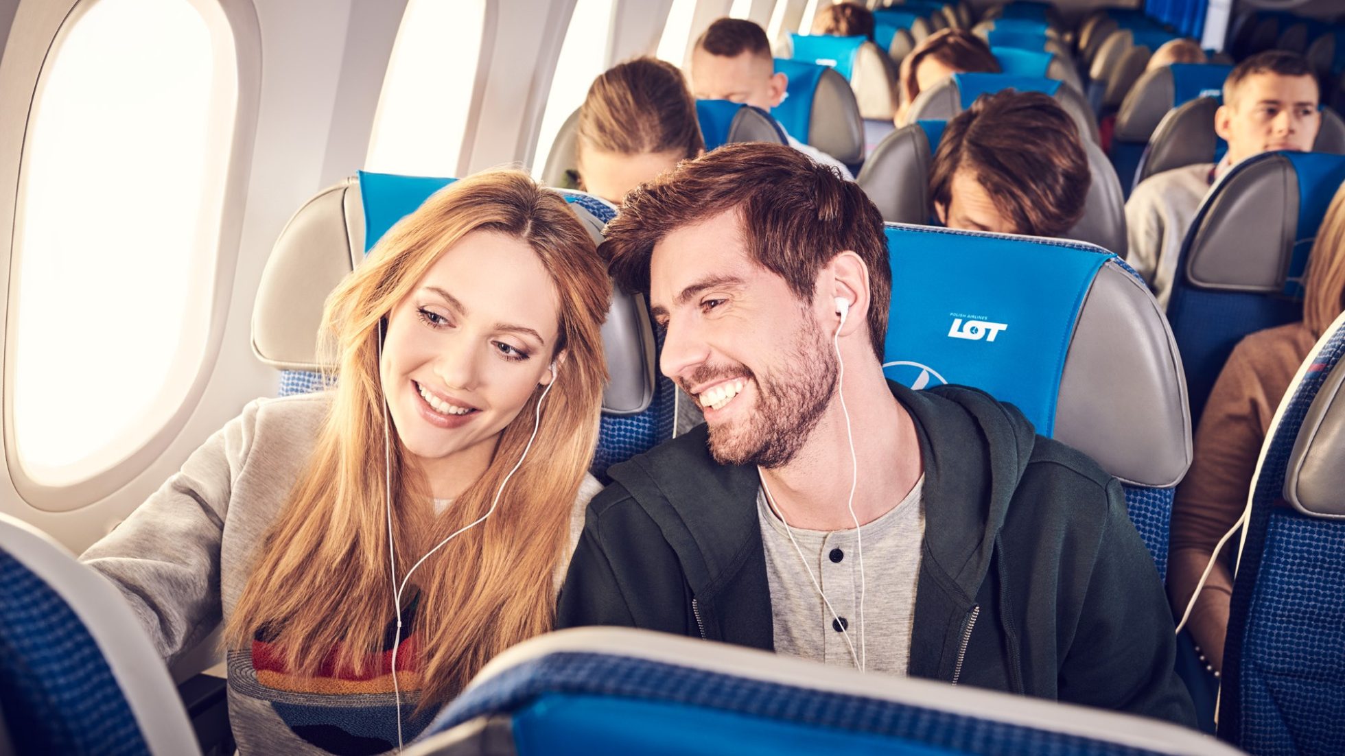 Smiling couple in LOT Economy Class