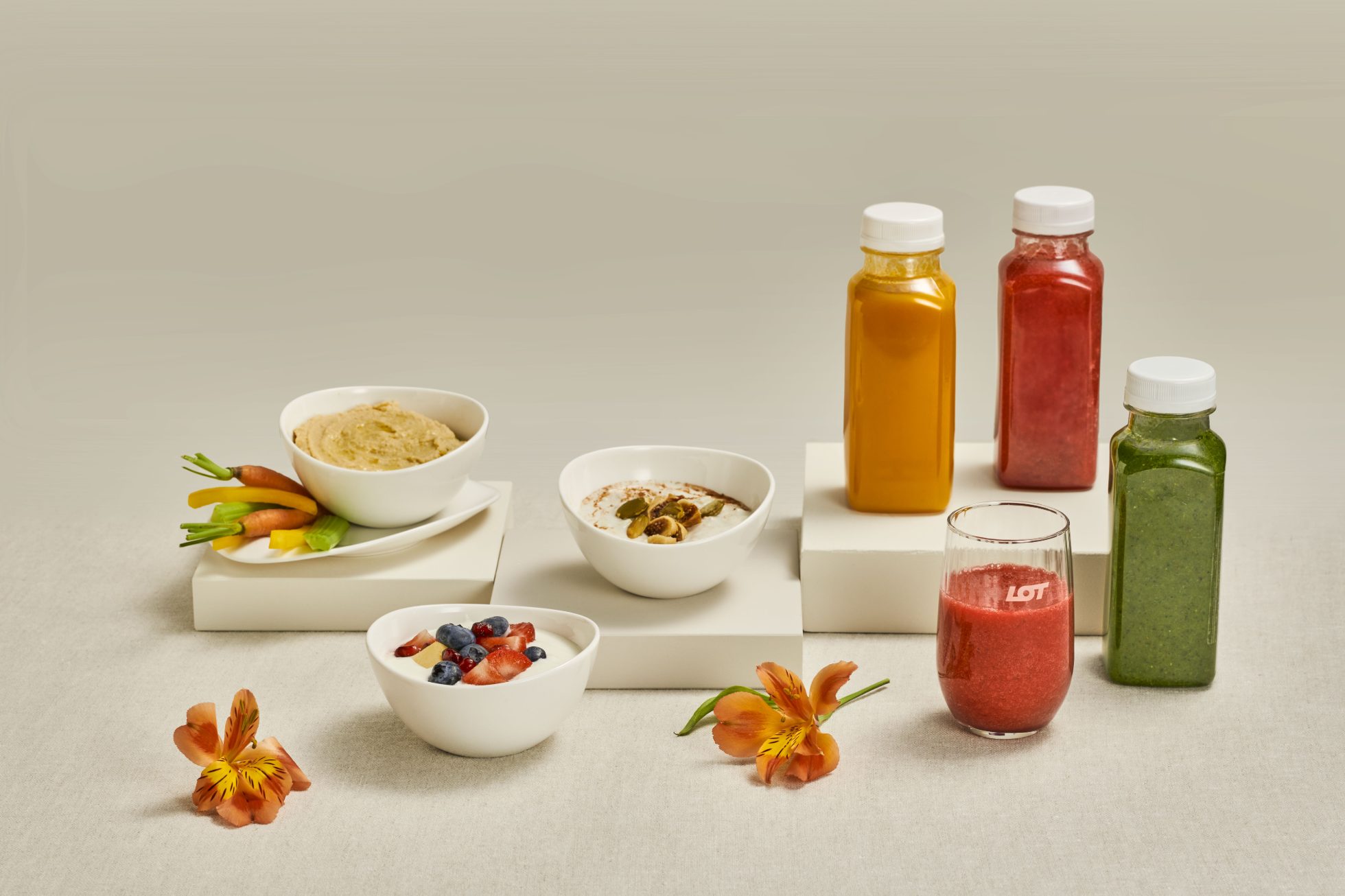 Photo shows healthy snacks on a wooden table background.